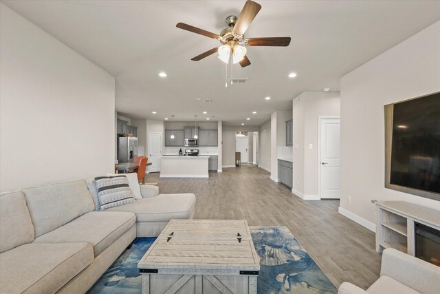 carpeted bedroom with ceiling fan