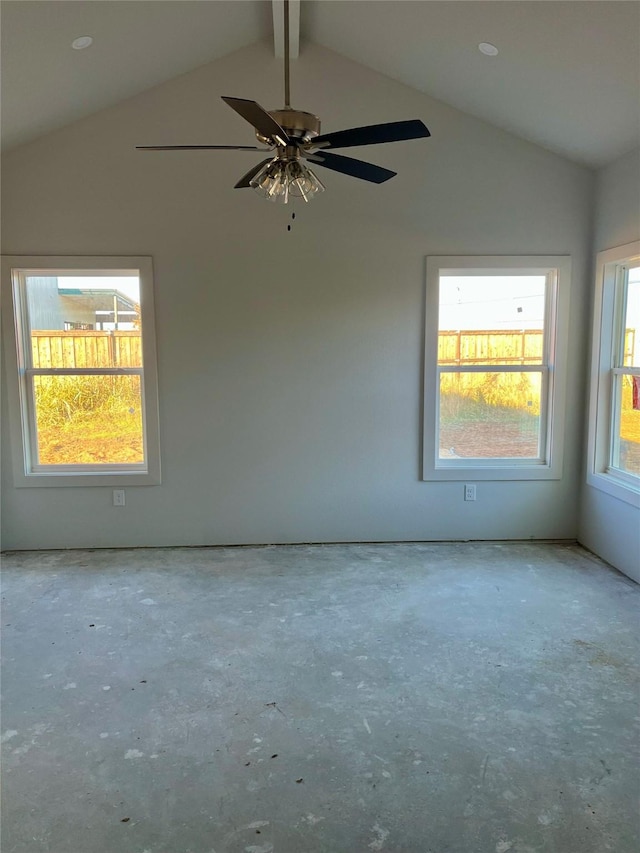 empty room with ceiling fan and lofted ceiling with beams