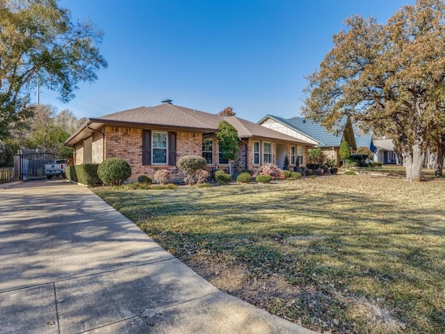 ranch-style home with a front lawn