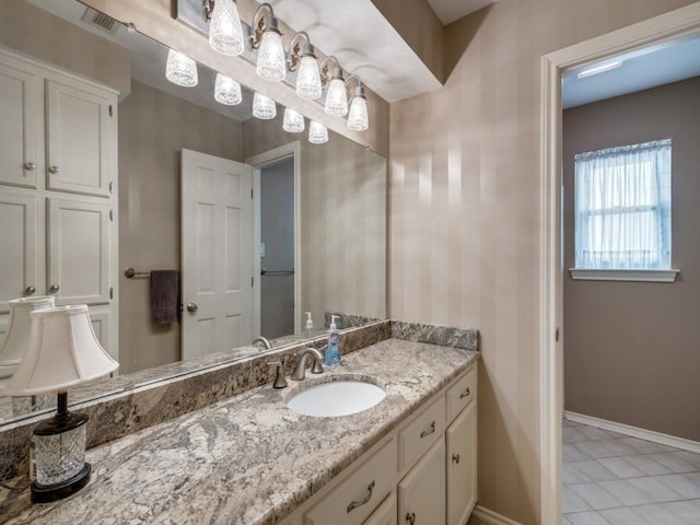 bathroom with vanity and tile patterned flooring