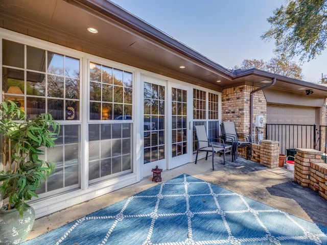 view of patio / terrace featuring a garage