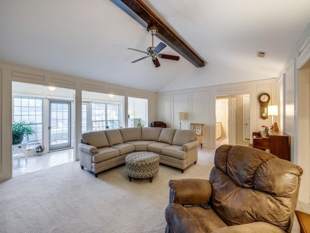 living room with light carpet, ceiling fan, high vaulted ceiling, and beamed ceiling