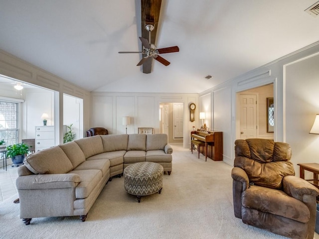 living room featuring vaulted ceiling, light carpet, and ceiling fan