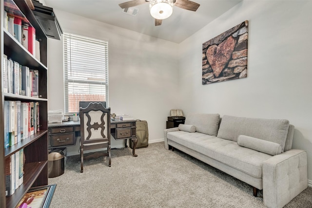 office featuring light carpet and ceiling fan