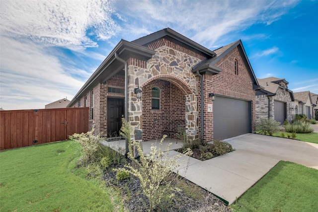 view of front facade with a garage and a front yard