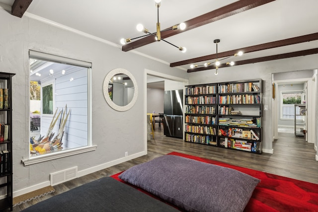 living area featuring beamed ceiling, dark wood-type flooring, and ornamental molding