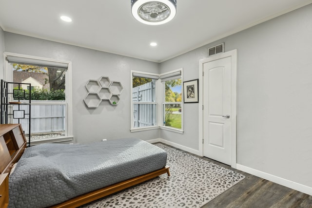 bedroom with dark wood-type flooring