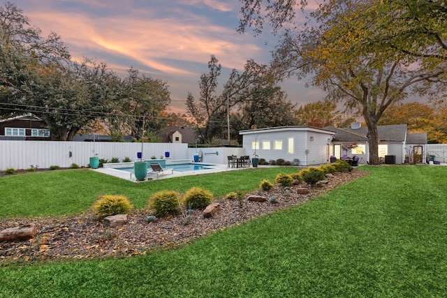 exterior space with a fenced in pool and a patio