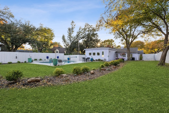 view of yard with a patio area and a fenced in pool