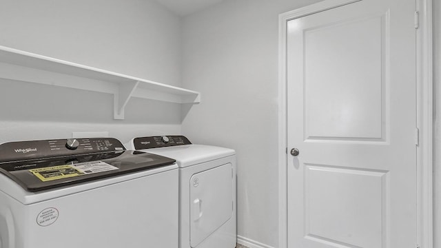 washroom featuring washer and dryer