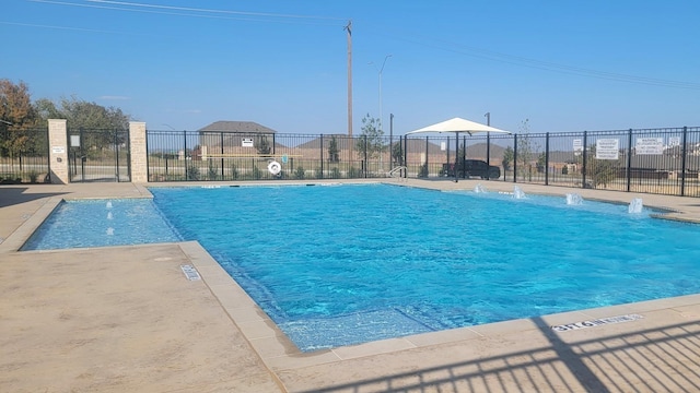 view of pool with pool water feature