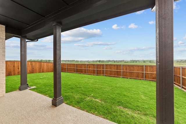 view of yard with a patio area and a fenced backyard