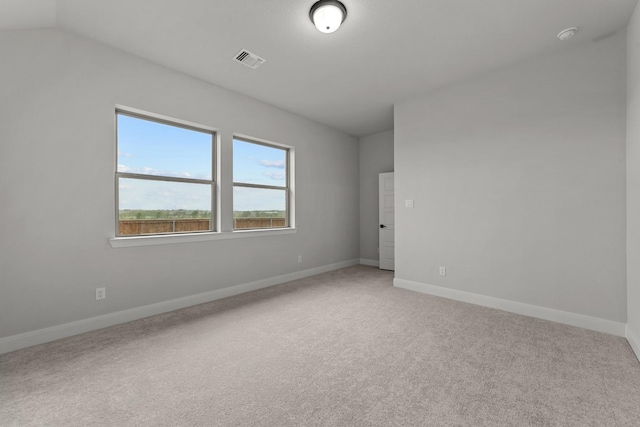 unfurnished room with light carpet, baseboards, and visible vents
