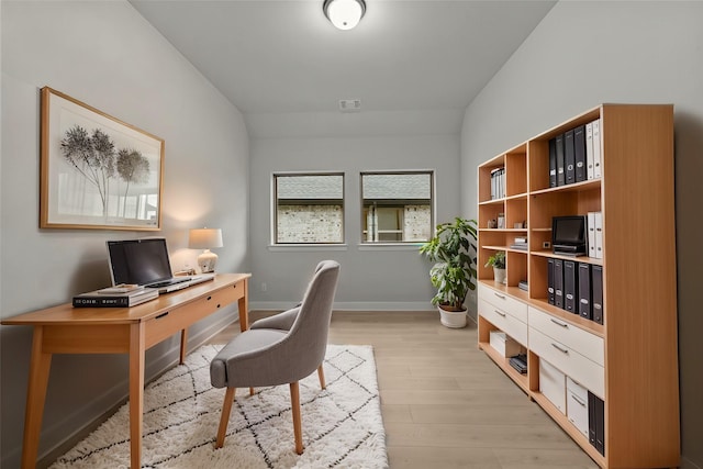 office space with visible vents, baseboards, and light wood finished floors