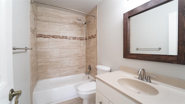 full bathroom with vanity, tiled shower / bath combo, toilet, and tile patterned flooring