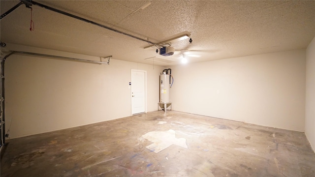 garage with gas water heater and a garage door opener