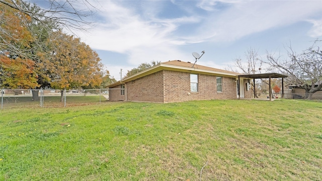 back of property featuring a lawn