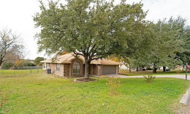 view of front facade with central AC, a front lawn, and a garage