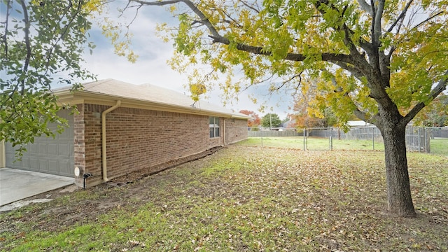 view of yard featuring a garage