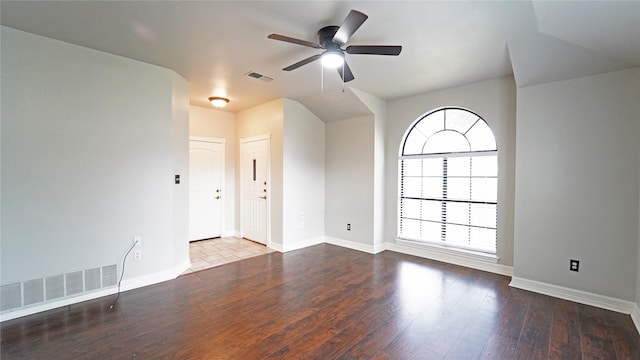 empty room featuring hardwood / wood-style flooring and ceiling fan