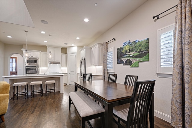 dining area featuring dark hardwood / wood-style flooring