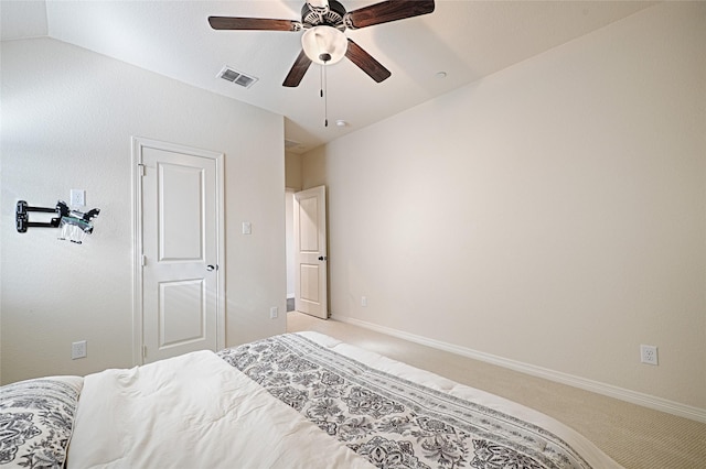 bedroom with light carpet, ceiling fan, and lofted ceiling