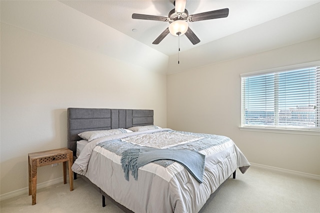 bedroom with ceiling fan, light carpet, and lofted ceiling