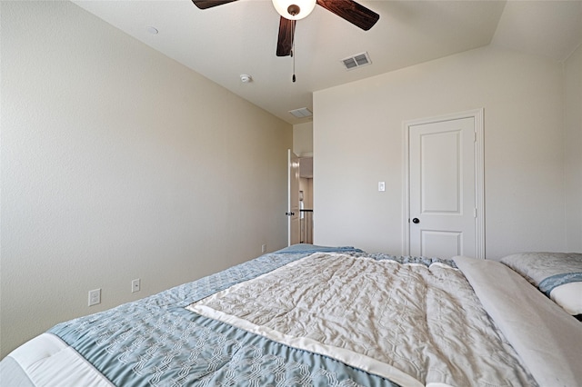 bedroom featuring ceiling fan and lofted ceiling