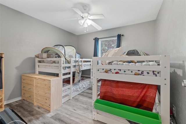 bedroom with hardwood / wood-style floors and ceiling fan