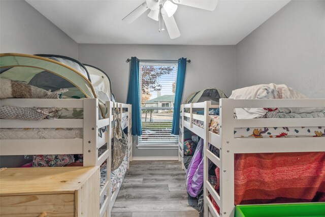 bedroom with hardwood / wood-style flooring and ceiling fan