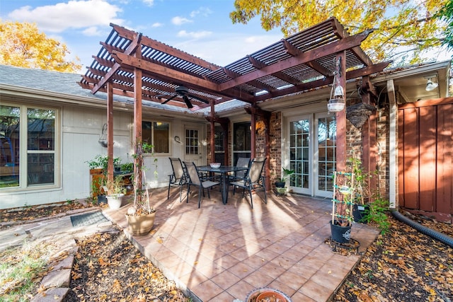 view of patio / terrace featuring ceiling fan, a pergola, and french doors