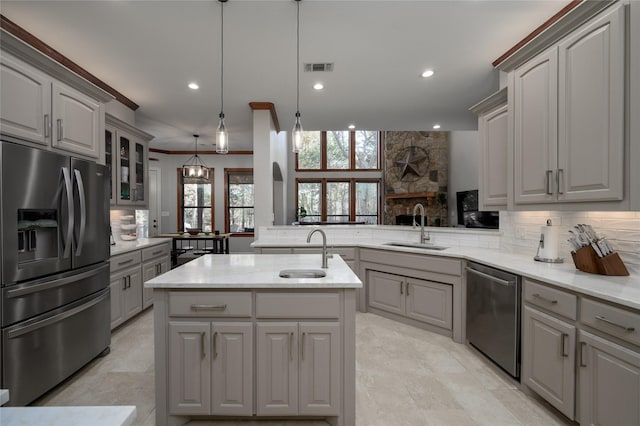 588 Lakepoint Loop, Pottsboro, TX 75076 - kitchen featuring appliances with stainless steel finishes, gray cabinets, backsplash, recessed lighting, and light stone counters
