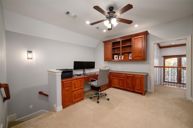 office featuring recessed lighting, visible vents, vaulted ceiling, and light carpet