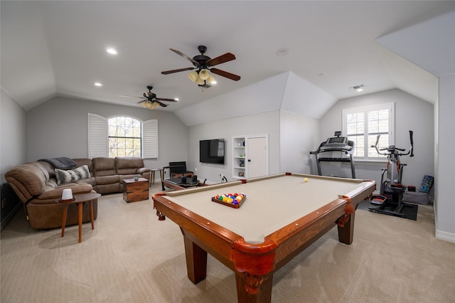 recreation room with light carpet, plenty of natural light, and vaulted ceiling