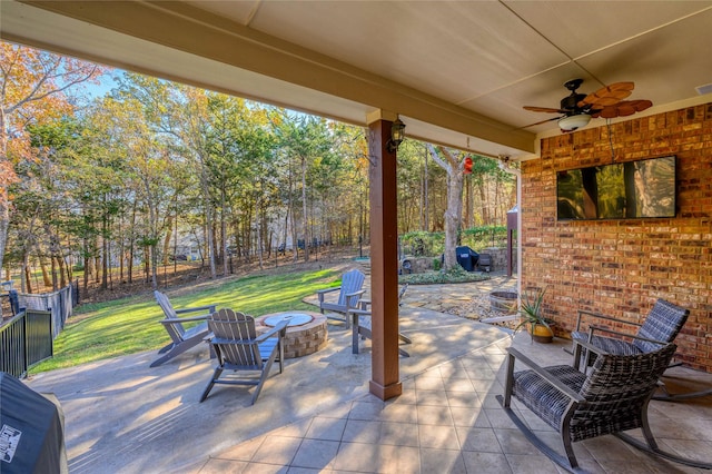 view of patio featuring an outdoor fire pit, visible vents, ceiling fan, and fence