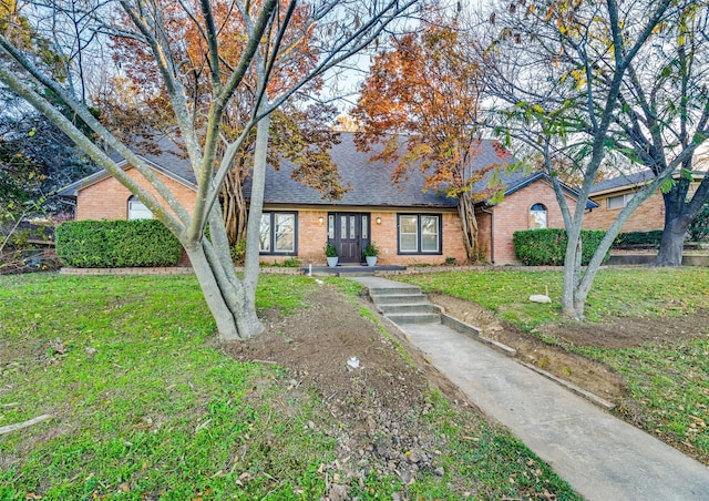 ranch-style house featuring a front lawn