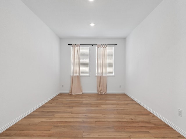 unfurnished room featuring light hardwood / wood-style flooring