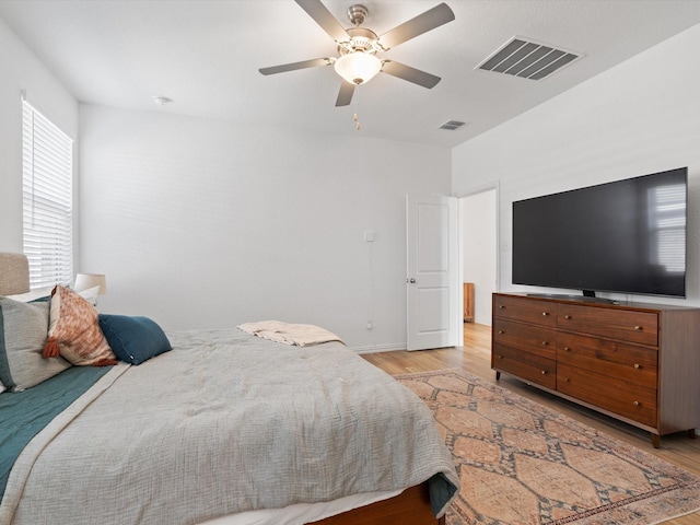 bedroom featuring ceiling fan and light hardwood / wood-style floors