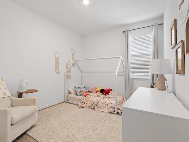 bedroom with wood-type flooring