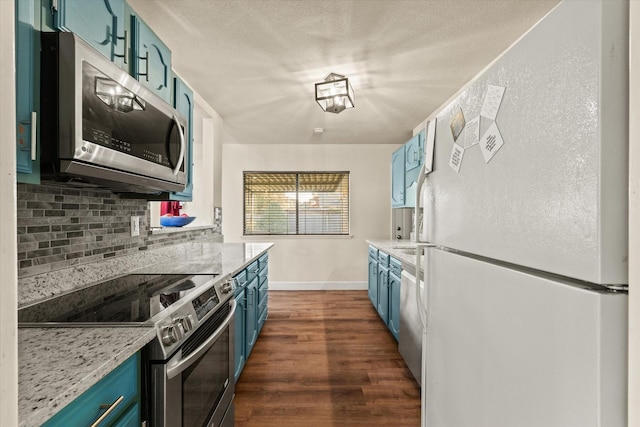 kitchen featuring blue cabinets, decorative backsplash, light stone countertops, dark hardwood / wood-style flooring, and stainless steel appliances