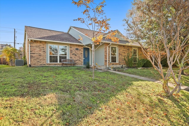 single story home with a front lawn and cooling unit