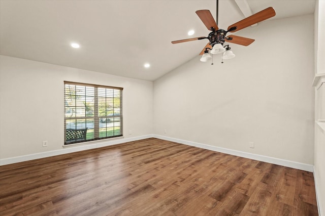 spare room featuring hardwood / wood-style floors, ceiling fan, and vaulted ceiling