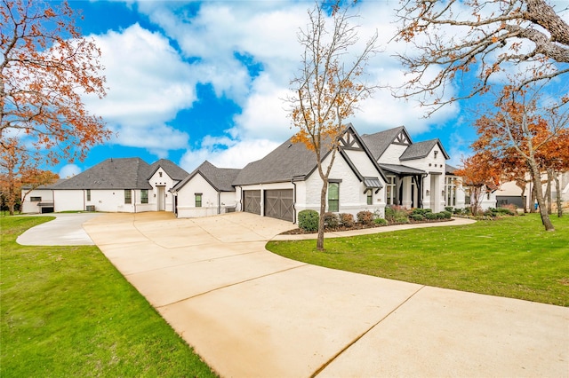 view of front of house with driveway, a front yard, a residential view, and a garage