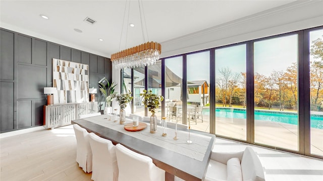 dining area featuring ornamental molding