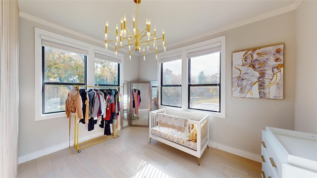 spacious closet featuring a chandelier