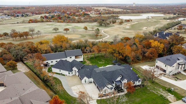 bird's eye view featuring a residential view, golf course view, and a water view
