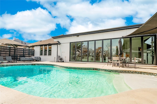 view of swimming pool with a patio area