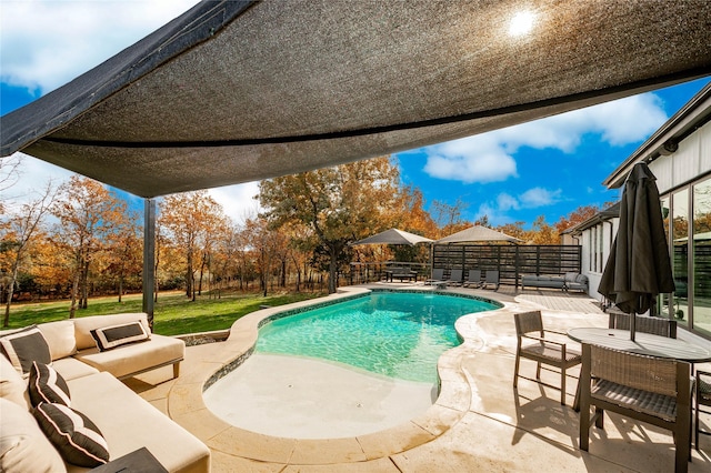 view of pool with outdoor lounge area and a patio