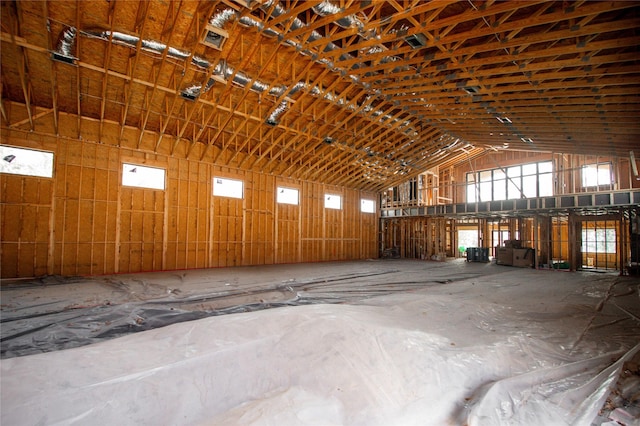 miscellaneous room with high vaulted ceiling