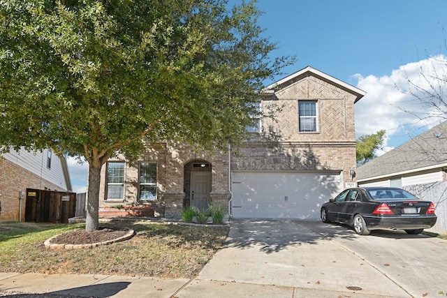 2812 Merry View Ln, Fort Worth, TX 76120 - traditional home with driveway, an attached garage, and brick siding